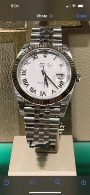 Timeless Rolex Datejust 41 with Elegant White Roman Dial